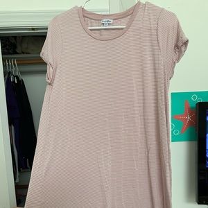 Pink and white striped dress goes down to knees.